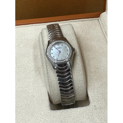 486A - A Ladies Ebel Diamond bezel watched, boxed with papers.