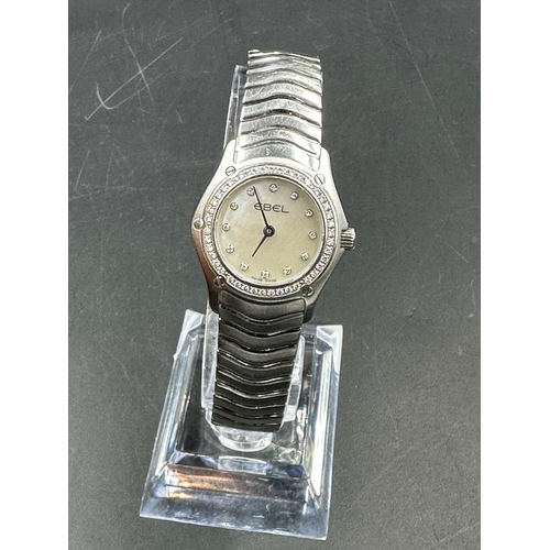 486A - A Ladies Ebel Diamond bezel watched, boxed with papers.