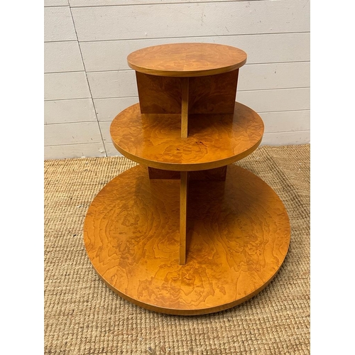 1 - A French Art Deco style bur elm ,three tier table comprising of three graduated disks on flat triang... 