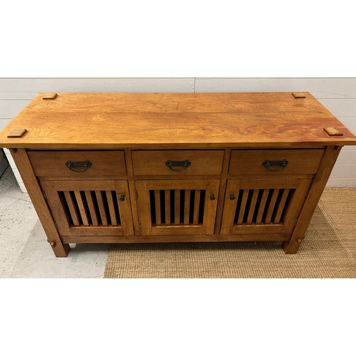 10 - A hardwood sideboard with three drawers and three cupboards under (H80cm W150cm D45cm)