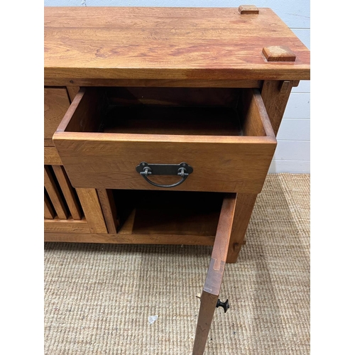 10 - A hardwood sideboard with three drawers and three cupboards under (H80cm W150cm D45cm)