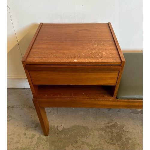 102 - A Mid Century Chippy telephone table upholstered in faux green leather