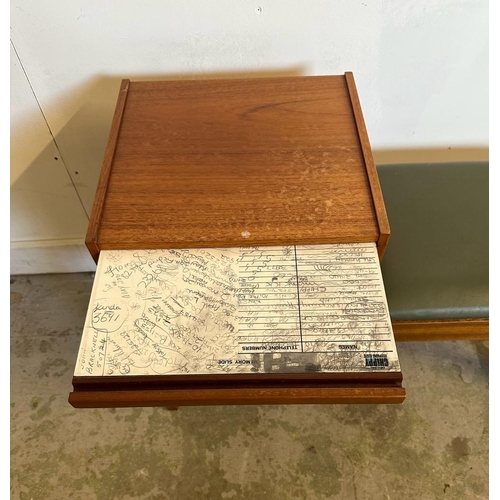 102 - A Mid Century Chippy telephone table upholstered in faux green leather