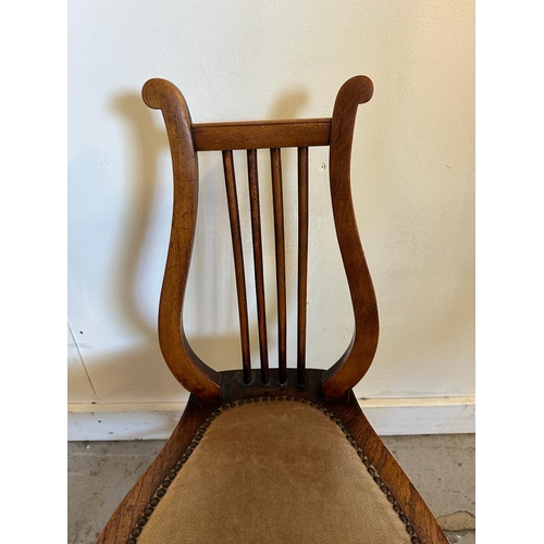 105 - A Victorian oak lyre chair (H74cm)