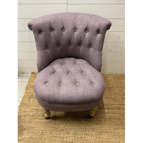 11 - A button back bedroom chair in lilac upholstery