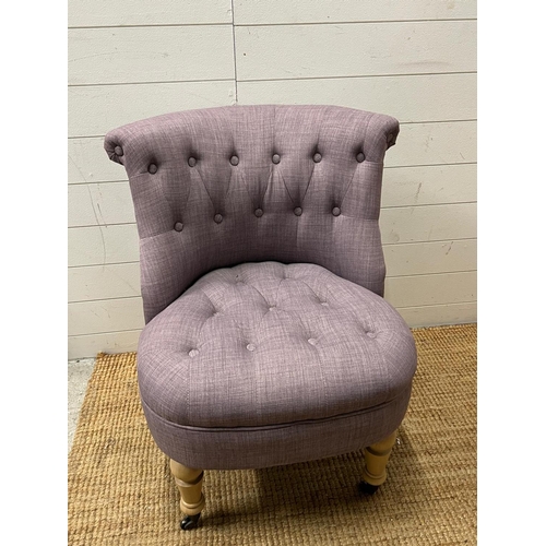 11 - A button back bedroom chair in lilac upholstery