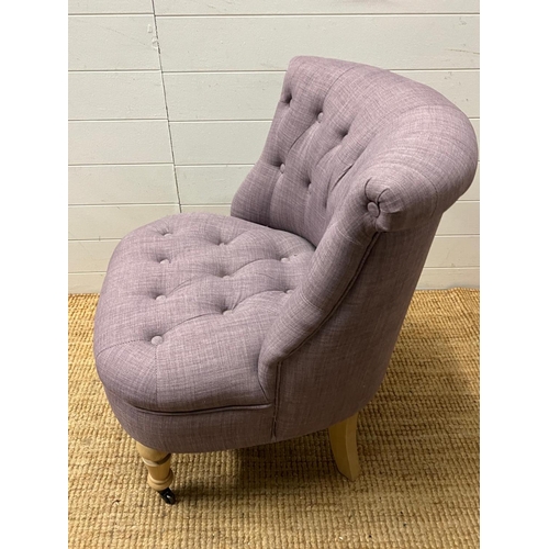 11 - A button back bedroom chair in lilac upholstery