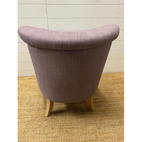 11 - A button back bedroom chair in lilac upholstery