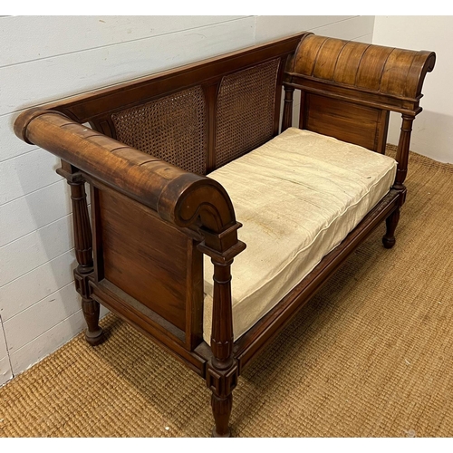 114 - A colonial style caned and carved settee/bergère (H89cm W150 D60cm)