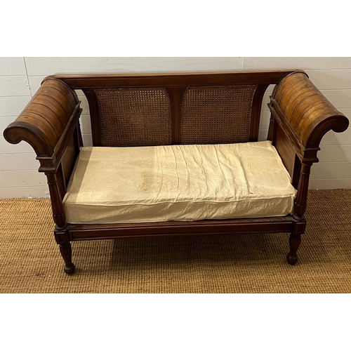 114 - A colonial style caned and carved settee/bergère (H89cm W150 D60cm)