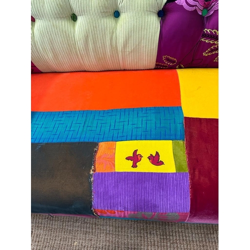 118 - A Disney themed patch work Chesterfield style button backed two seater sofa (H78cm W200cm D90cm SH40... 