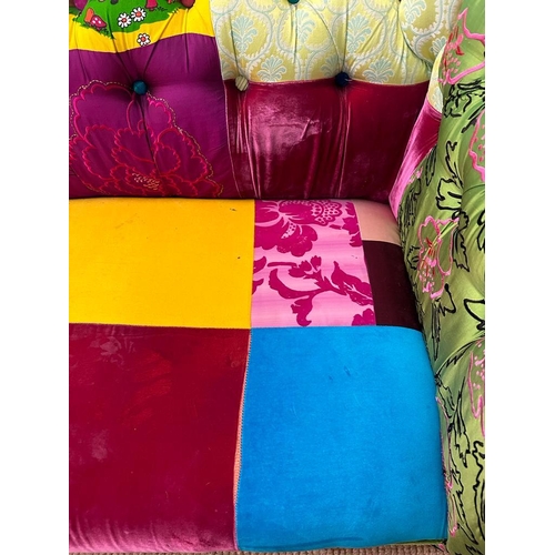 118 - A Disney themed patch work Chesterfield style button backed two seater sofa (H78cm W200cm D90cm SH40... 