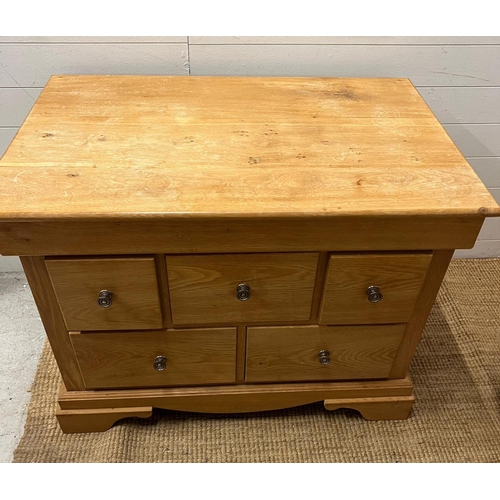 12 - A light oak chest of drawers (H79cm W101cm D63cm)