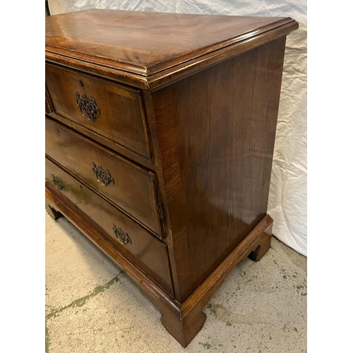 138 - A flame mahogany two over three chests of drawers on bracket feet (H83cm W92cm D47cm)