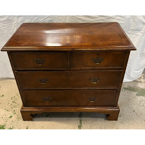 138 - A flame mahogany two over three chests of drawers on bracket feet (H83cm W92cm D47cm)