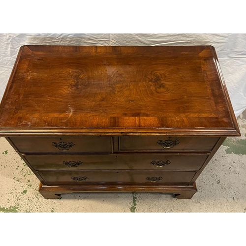 138 - A flame mahogany two over three chests of drawers on bracket feet (H83cm W92cm D47cm)