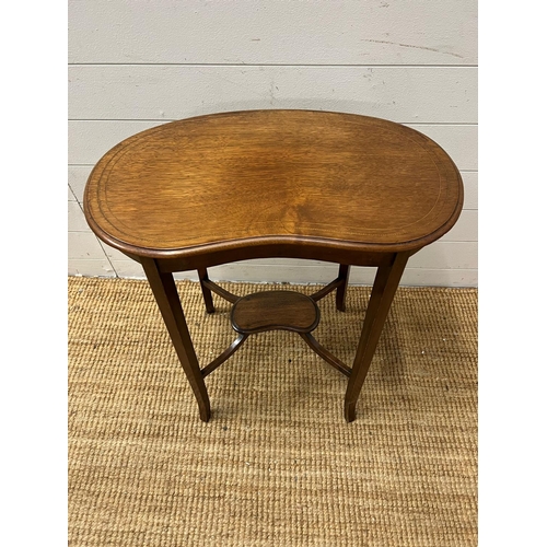 141 - A kidney shaped side table on tapering out swept legs (H68cm W62cm D36cm)