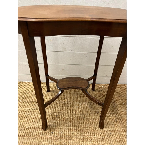 141 - A kidney shaped side table on tapering out swept legs (H68cm W62cm D36cm)