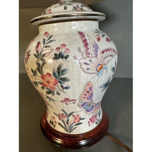 180 - A ceramic painted table lamp with flower and butterfly detail