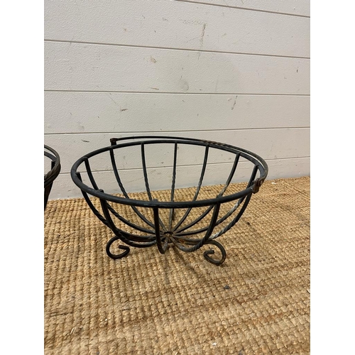 202 - Two black wrought iron baskets possibly hanging baskets