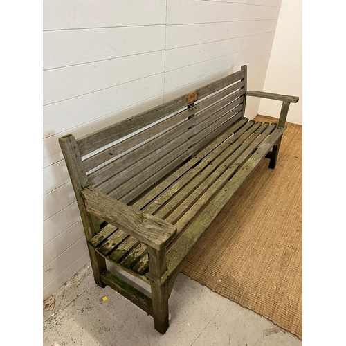 203 - A wooden slatted garden bench