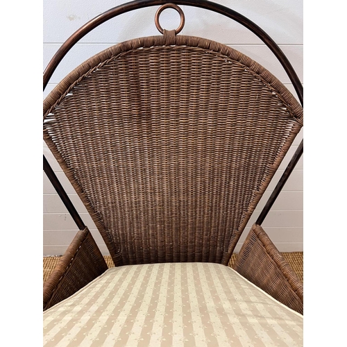 204 - A metal rattan rustic garden suite comprising of a two seater sofa, his and her chairs, footstool an... 