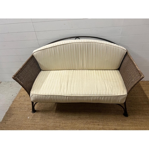 204 - A metal rattan rustic garden suite comprising of a two seater sofa, his and her chairs, footstool an... 