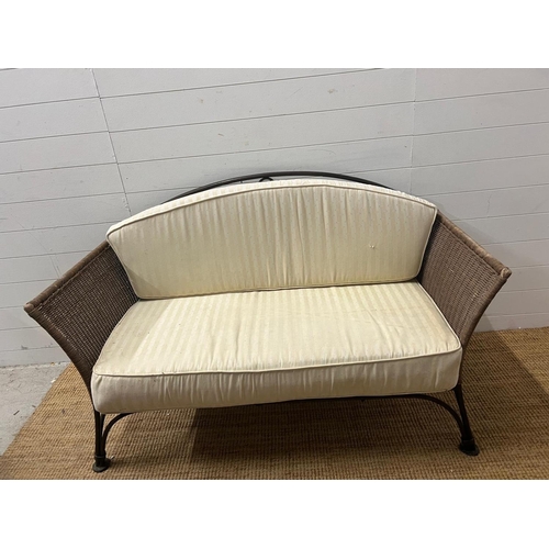 204 - A metal rattan rustic garden suite comprising of a two seater sofa, his and her chairs, footstool an... 