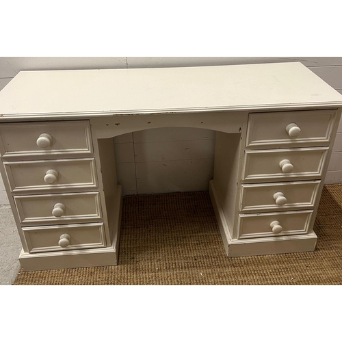 22 - A pine dressing table/desk painted white (H76cm W130cm D46cm)