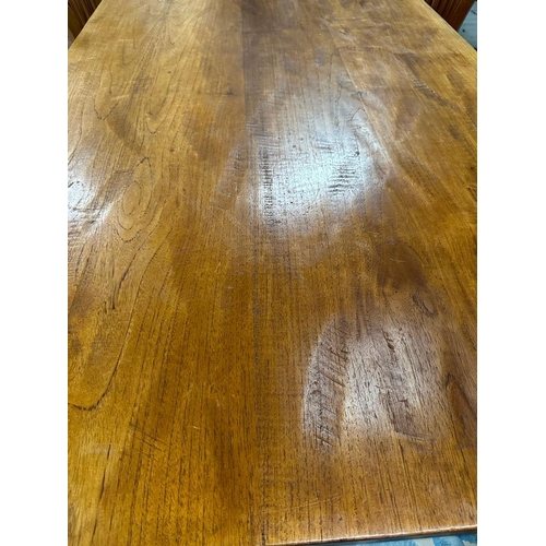 23 - An oak dining table with four chairs and two carvers