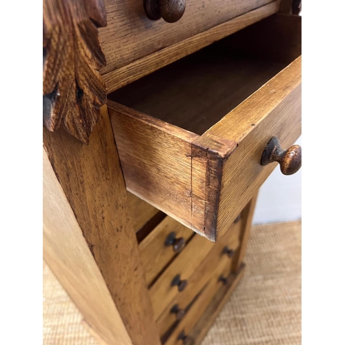 24 - A light oak Wellington chest with graduating drawers (H104cm W51cm D36cm)