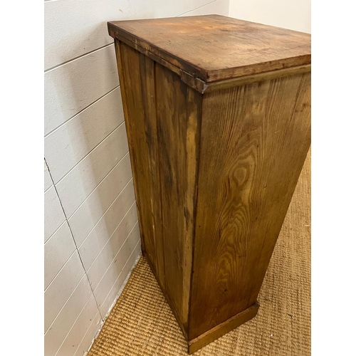 24 - A light oak Wellington chest with graduating drawers (H104cm W51cm D36cm)