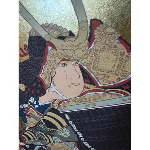 276 - A Japanese four fold screen of a warrior painted on paper, signed. (43cm x 92cm each panel)