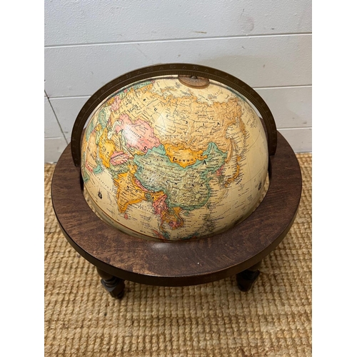 29 - A desk top globe by Replogle globes made is USA on a mahogany stand