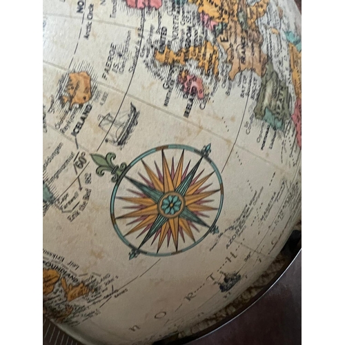 29 - A desk top globe by Replogle globes made is USA on a mahogany stand