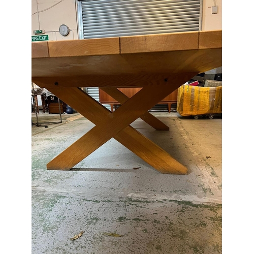 3 - A large six plank light oak refectory table with X frame legs (H76cm W305cm D121cm)