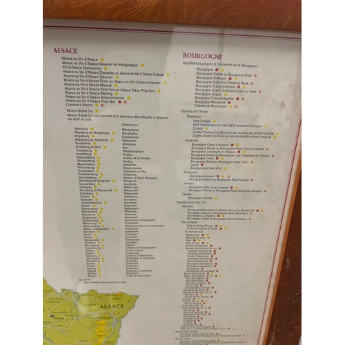 300 - A poster of Frances wine regions and vin yards and framed wine labels (SQ95cm)