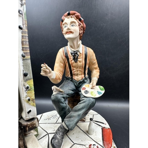 308 - A large Capodimonte figure of an artist by Fiorenzo Meneghetti. Number 421 of a numbered edition