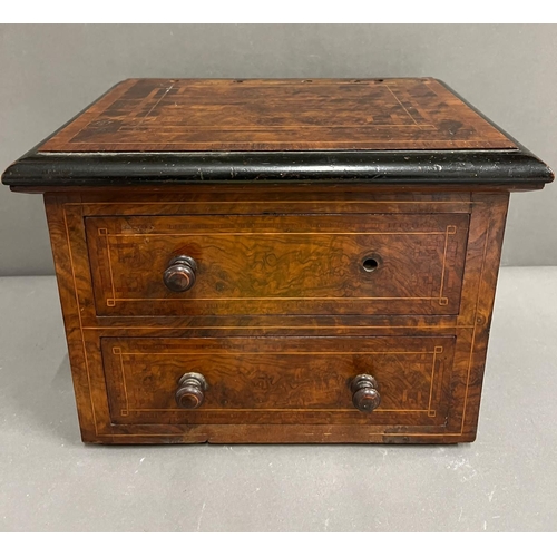 32 - A two drawer table top cabinet with string inlay AF (H25cm W32cm D24cm)