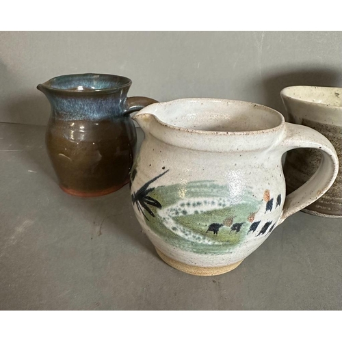 335 - Five Studio pottery items, jugs, a vase and a beaker