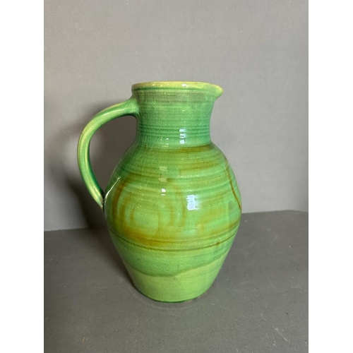 336 - A Studio pottery green ground jug and a blue ground vase