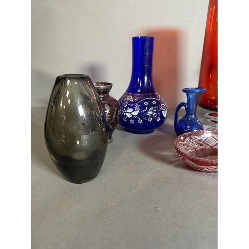 337 - A selection of coloured glass to include vases, jugs and dishes