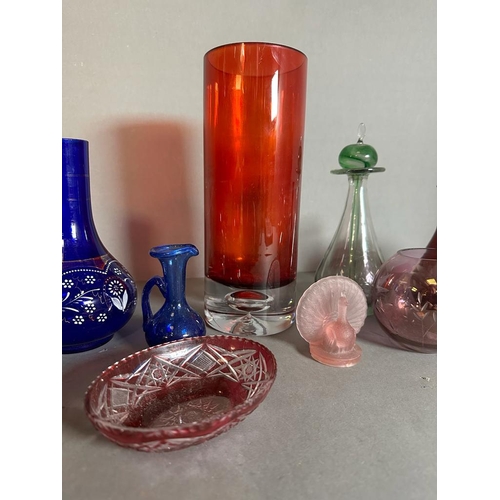 337 - A selection of coloured glass to include vases, jugs and dishes