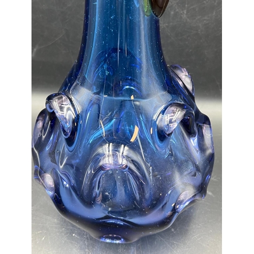 360 - A cobalt blue Art glass jug with pulled base and amber handle (H43cm)