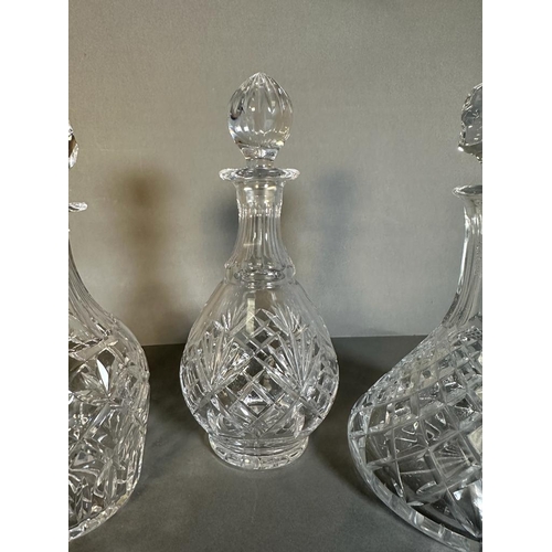 380 - Three cut glass decanters