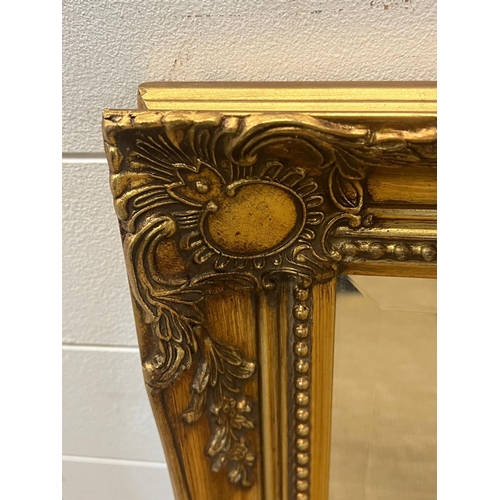 391 - A gilt framed mirror 115cm x 92cm