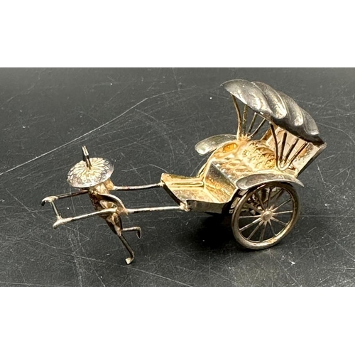 406 - A miniature silver tuk tuk, marked 925 (total weight 12.5g)