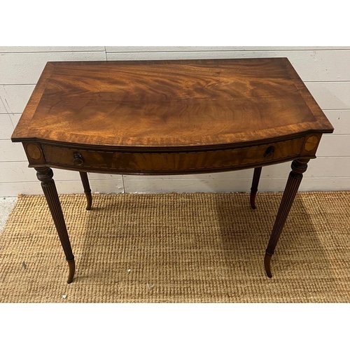 43 - A Regency style mahogany side table on tapering out swept legs (H74cm W82cm D47cm)