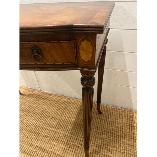 43 - A Regency style mahogany side table on tapering out swept legs (H74cm W82cm D47cm)