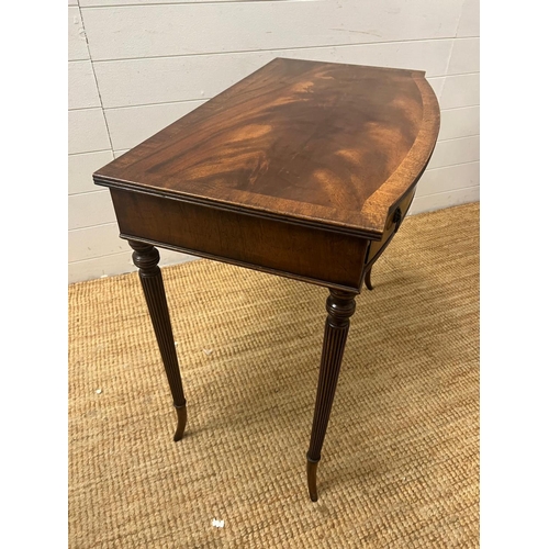 43 - A Regency style mahogany side table on tapering out swept legs (H74cm W82cm D47cm)